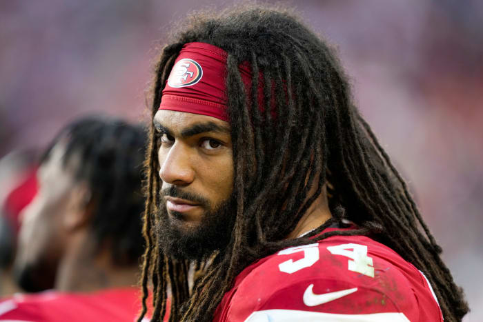 A headshot of Fred Warner, on the sideline during a 49ers game